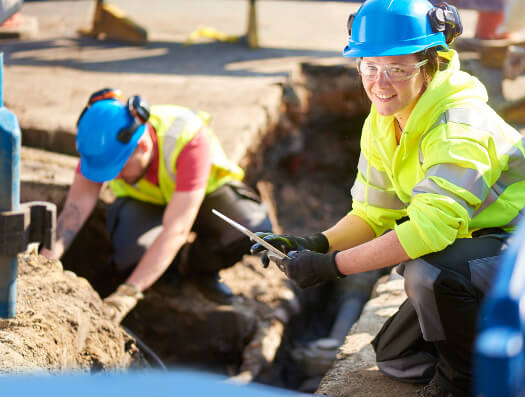 Engineers replacing old pipes